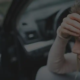 Woman in an accident calling police.